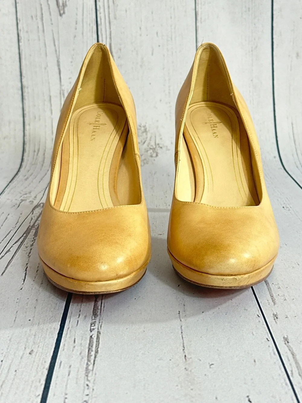 Cole Haan Chelsea pumps featuring a stacked heel and tan leather women’s size 9B